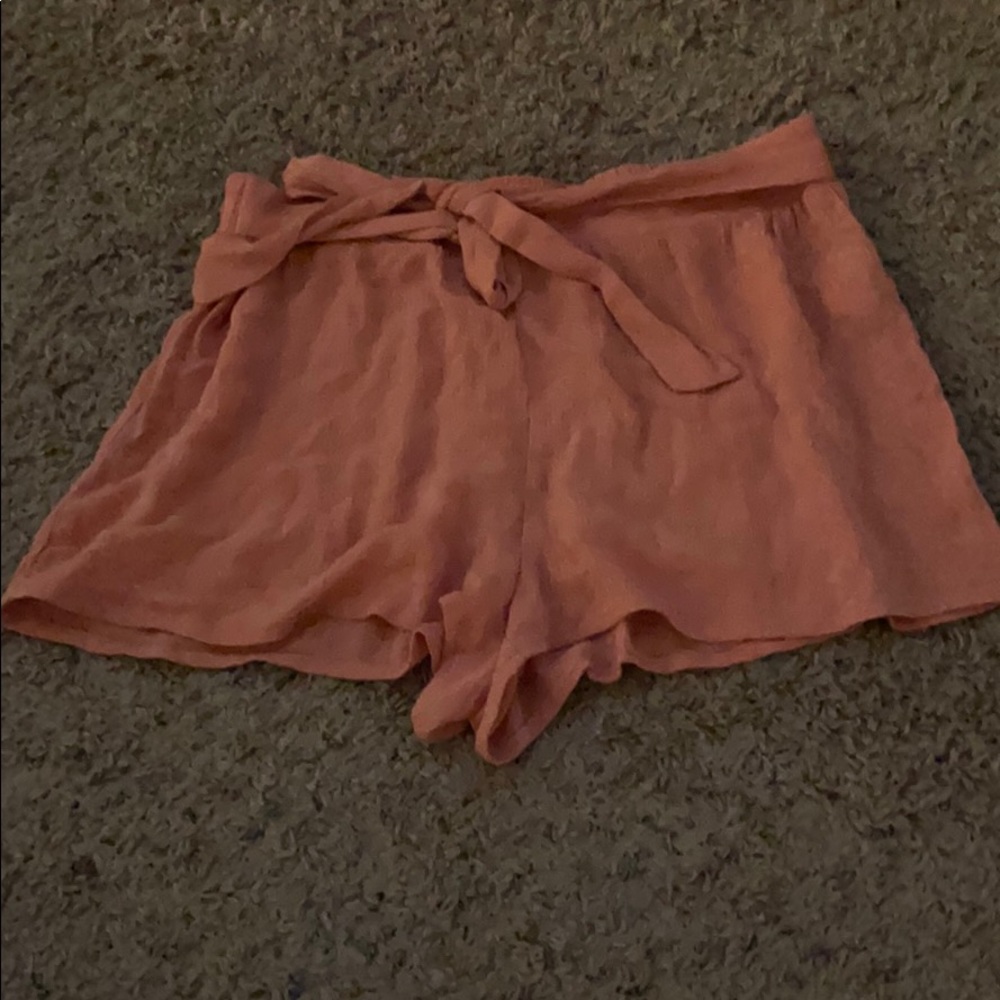 Shorts size larger , tie front with elastic band
